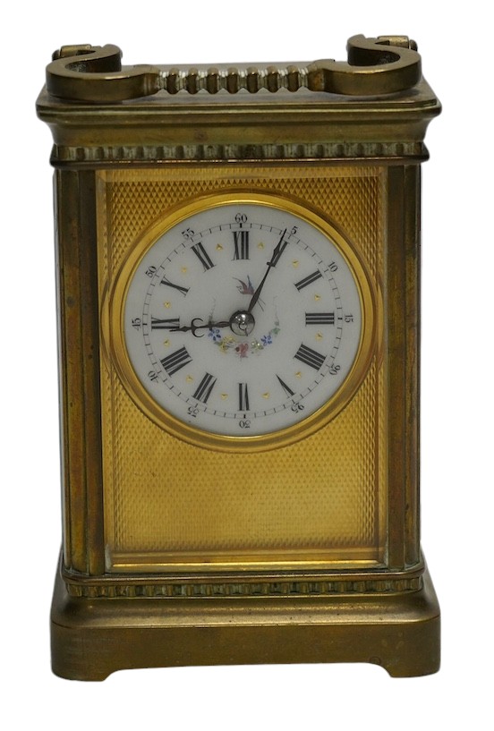 A brass cased carriage timepiece with enamel dial, with key, 15cm high. Condition - good, not tested